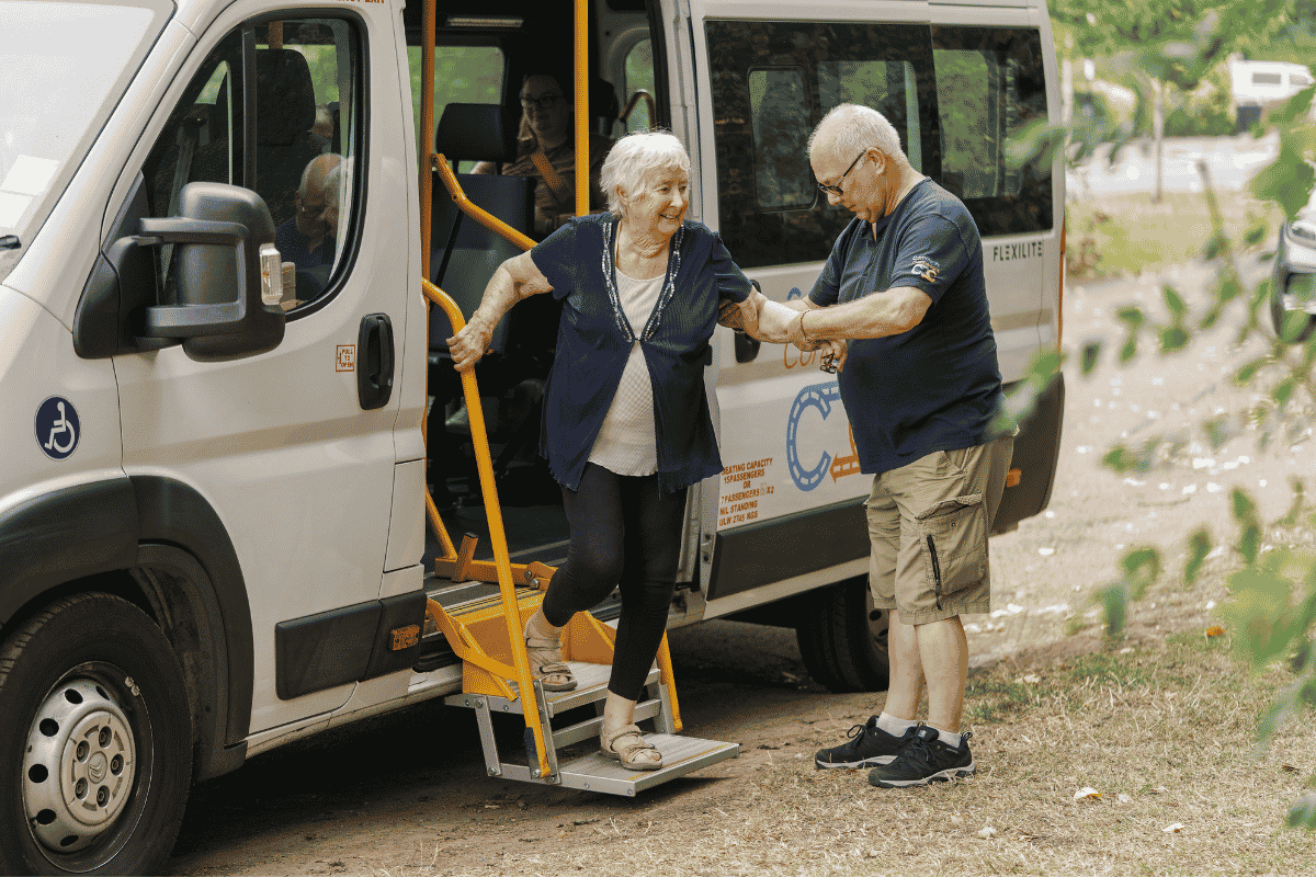 Community transport minibus collecting passengers