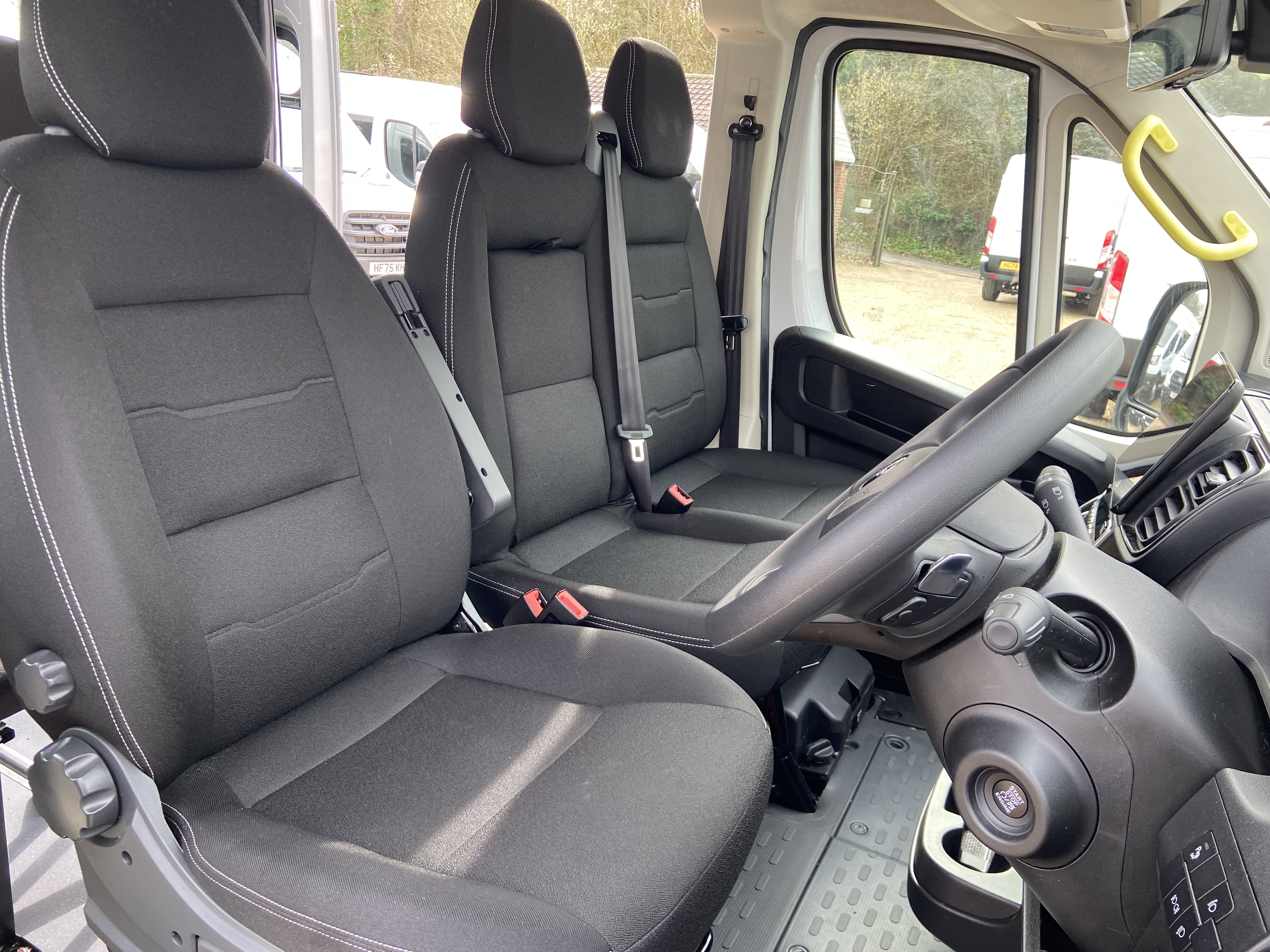 Cloth driver and passenger seats in the electric CVMinibus cab