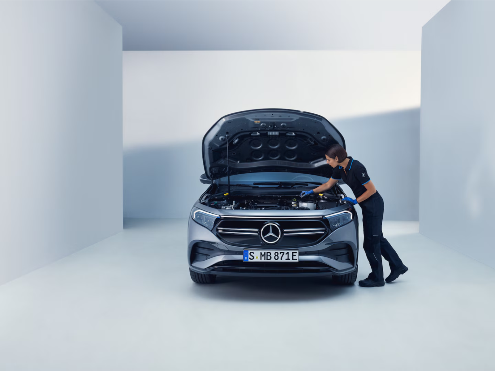 Mercedes-Benz technician inspecting a vehicle