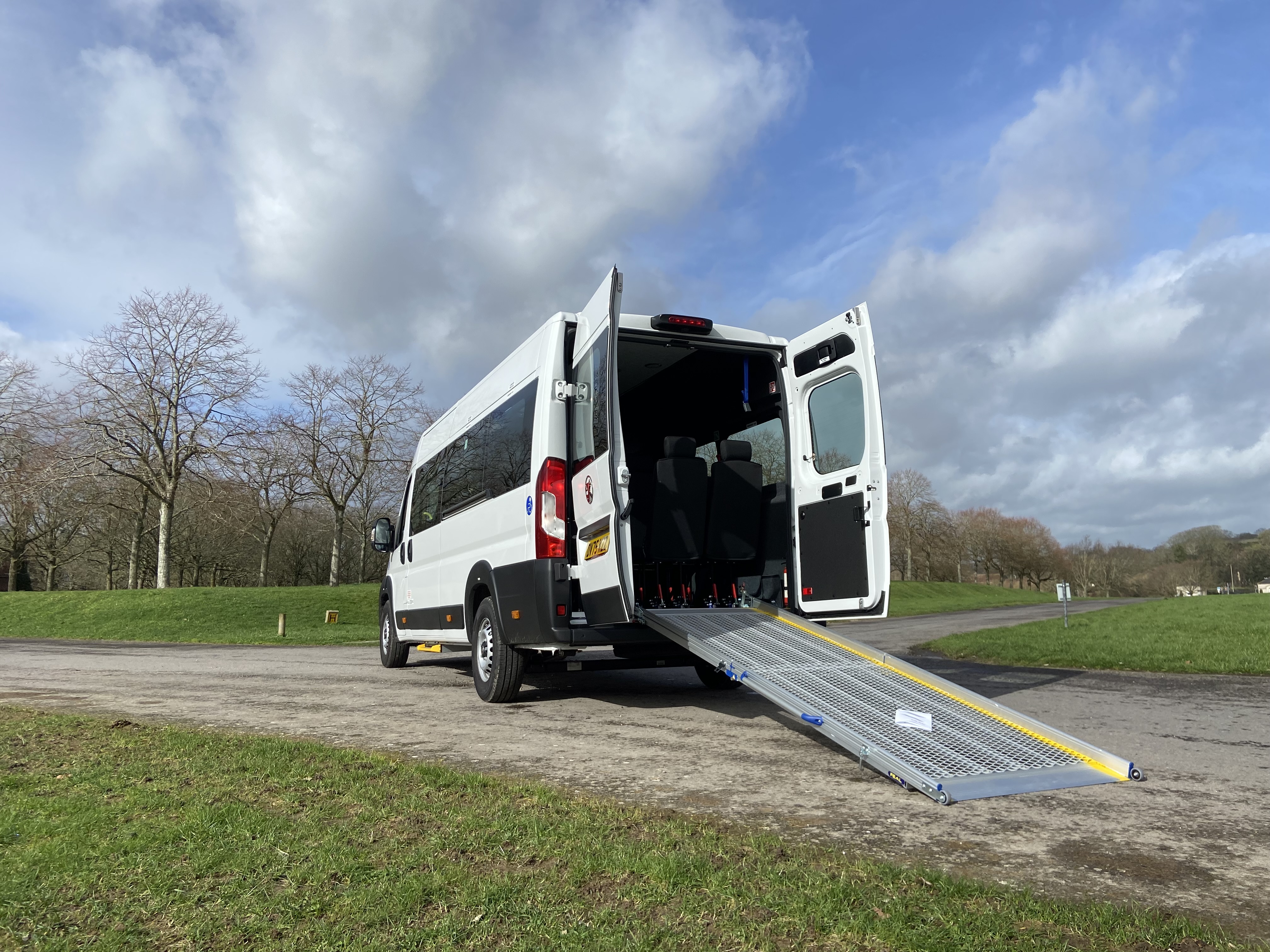 Interior of a CVM accessible minibus — grab rails, belts and wheelchair bay