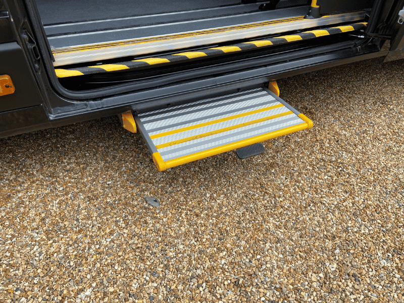 Fold-out side step with handrails on a CVM accessible minibus