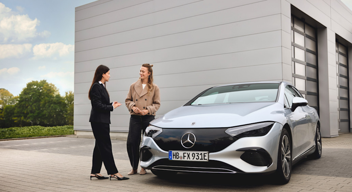 Mercedes-Benz customer speaking with a member of the team beside a vehicle